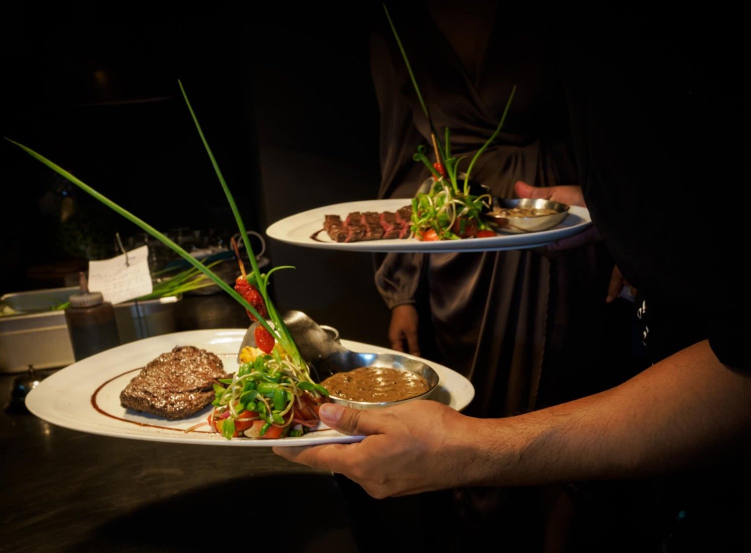 EAT official restaurant menu photograph of plated meat and vegetables