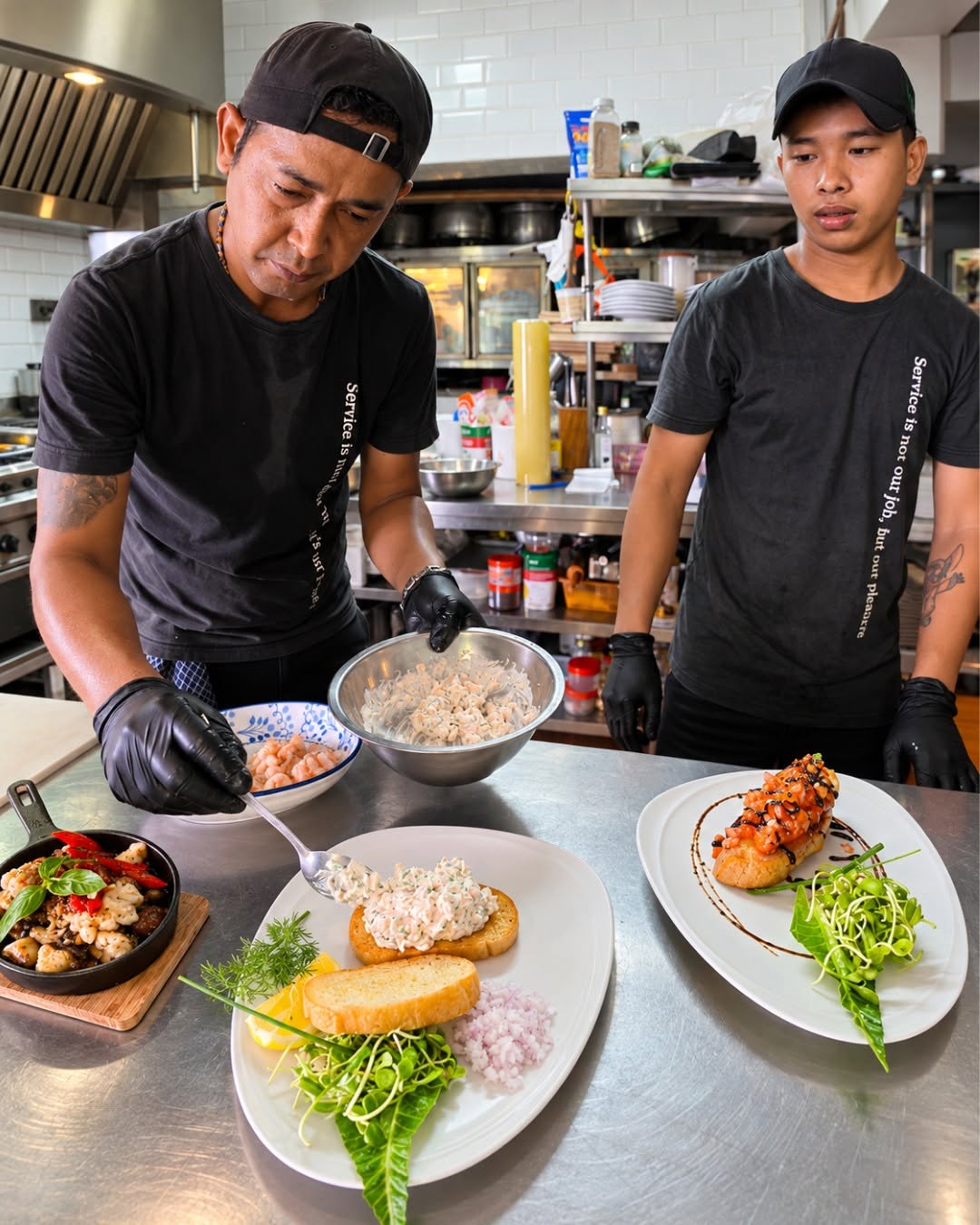 Actual EAT restaurant chefs plating food